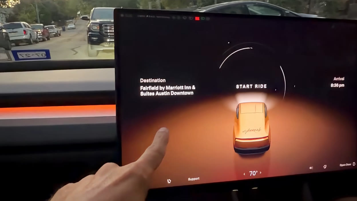 The Cybercab rider screen showing the destination, arrival time and a 3D render of the vehicle